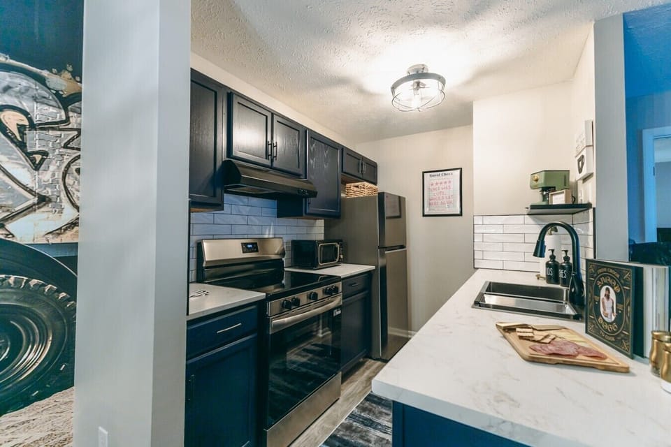 Kitchen | Quartz Counters & Stainless Steel Appliances | Subway Tile Backsplash