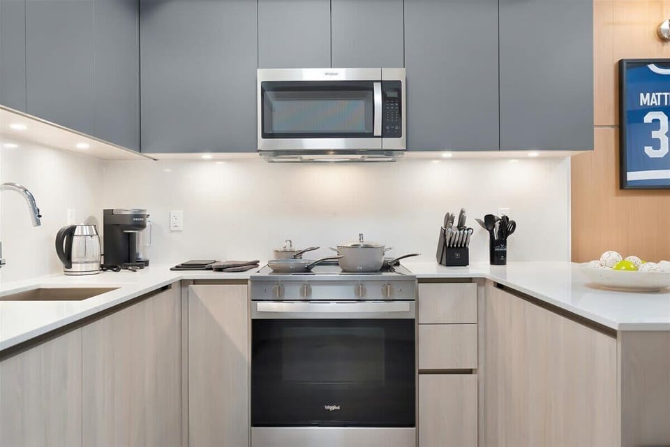 Modern kitchen with stainless steel appliances and sleek finishes