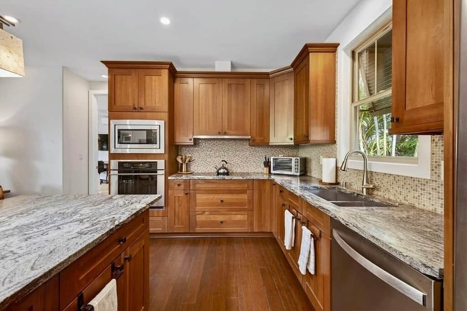 Custom mosaic backsplash. This kitchen is as gorgeous as it is useful.