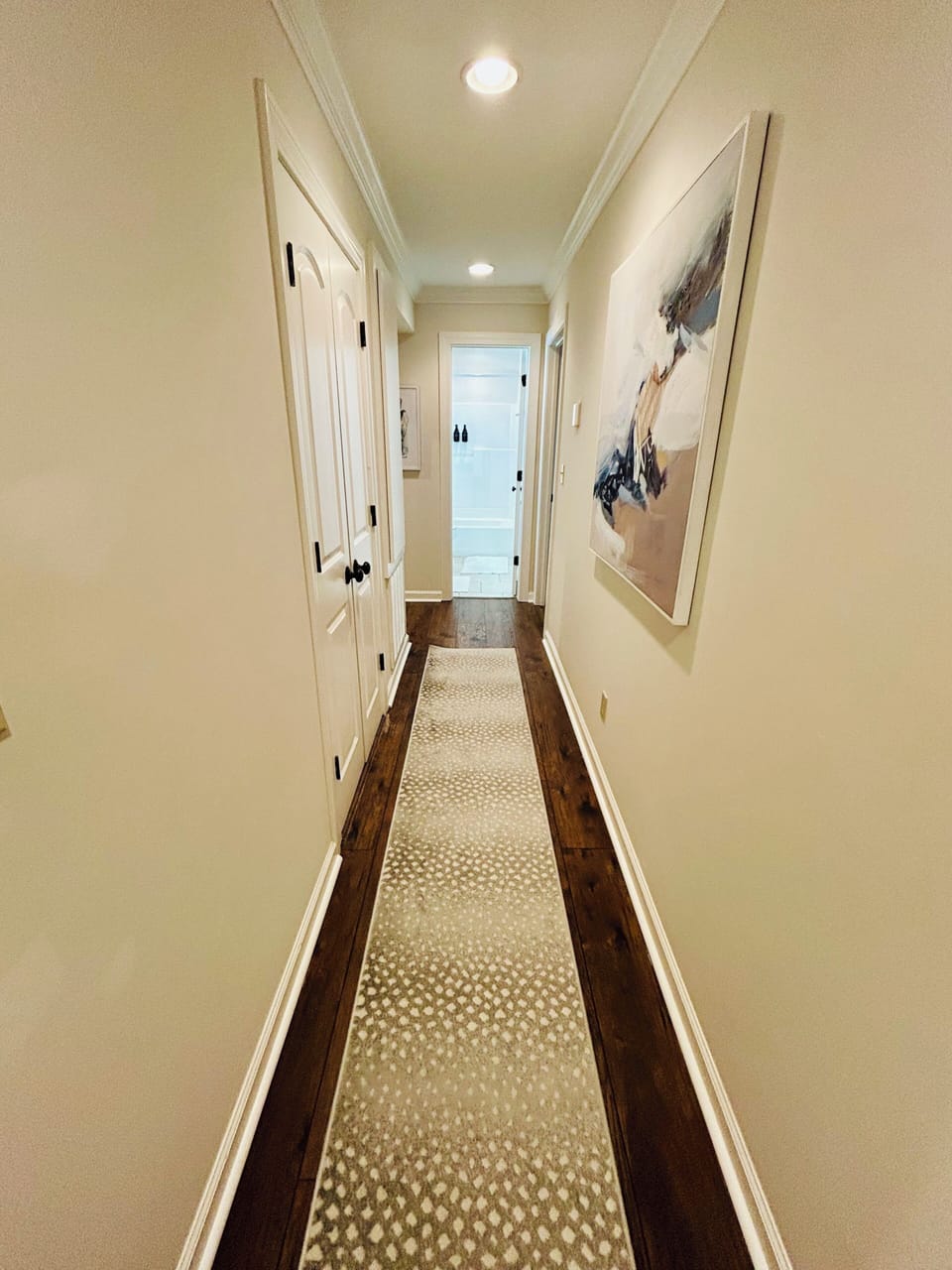 Bright, stylish hallway with wood floors and elegant modern decor