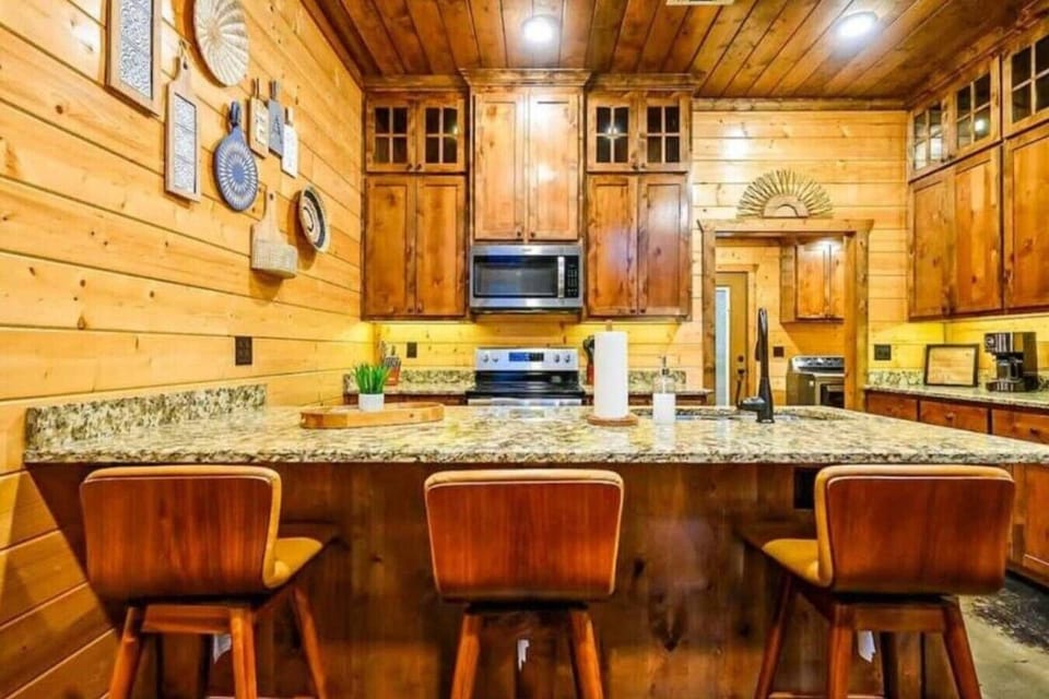 Beautiful wood cabinetry and granite island—perfect for family gatherings.