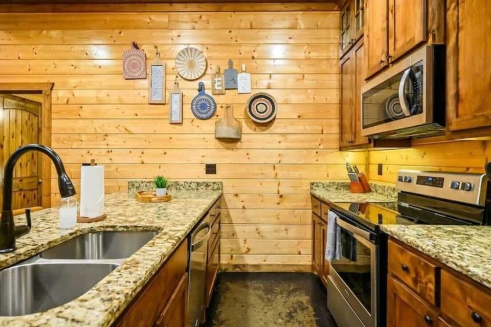 Kitchen with microwave, stove/oven & dishwasher.