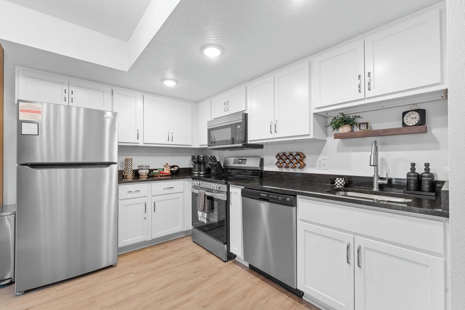 Fully stocked kitchen with everything needed to prepare meals.