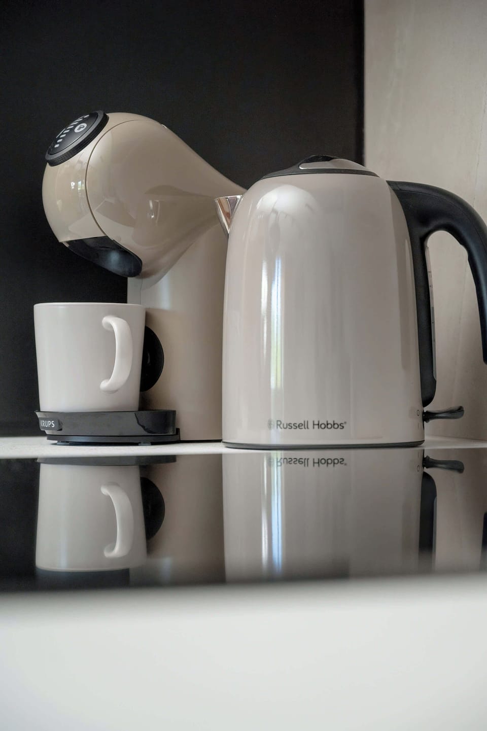 Coffee and tea station with modern appliances for added guest convenience.