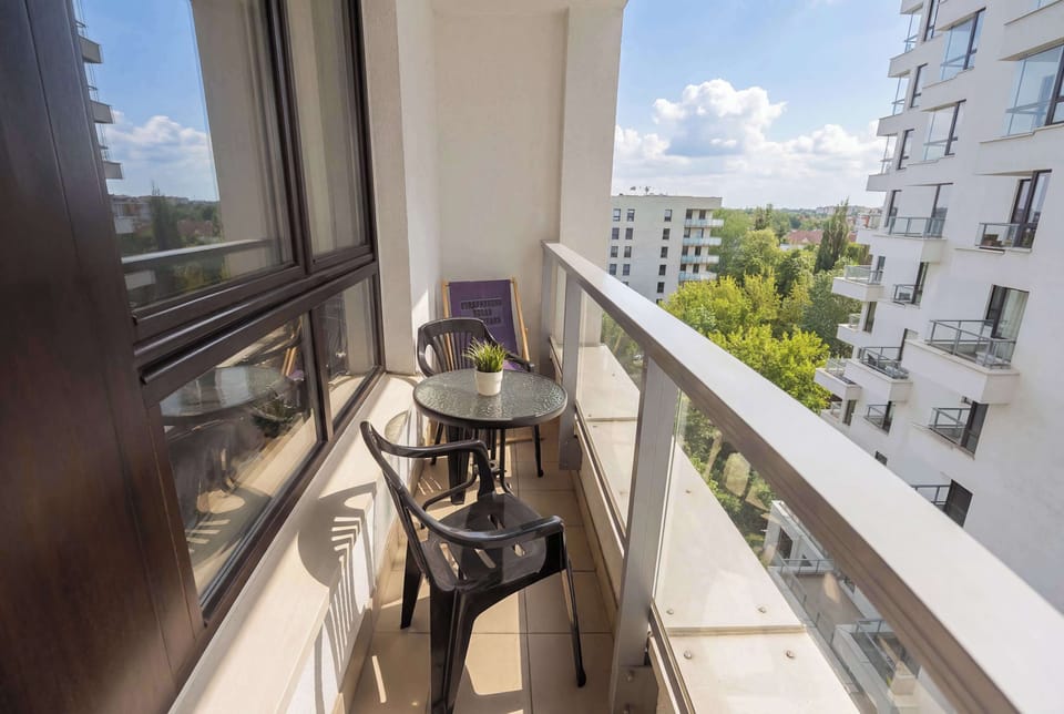 The balcony's peaceful ambiance is ideal for unwinding.