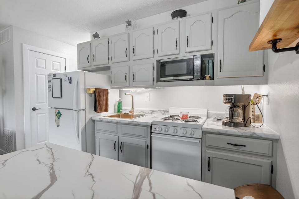 Your fully equipped kitchen features elegant marble countertops, modern appliances, and all the essentials you need to prepare delicious home-cooked meals during your stay.