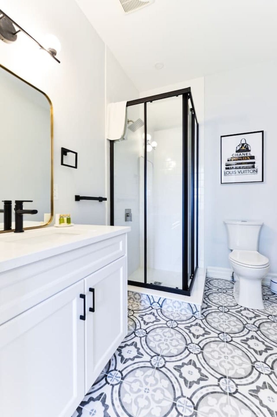 Refresh and recharge in the modern bathroom, featuring a walk-in shower, plush towels, and complimentary amenities for a comfortable stay.