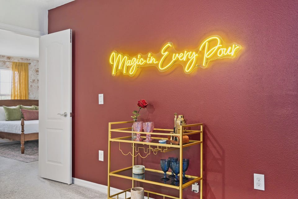 Princess theatre drink station with neon storybook bar sign
