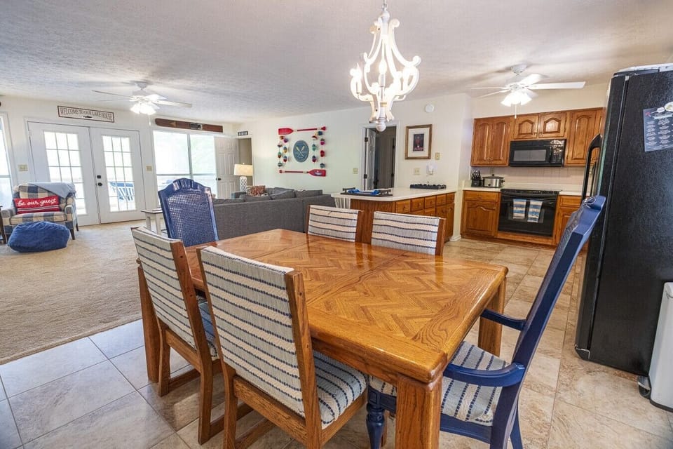 Dining Area | Wood Table & Upholstered Seating | Open Kitchen & Living Room