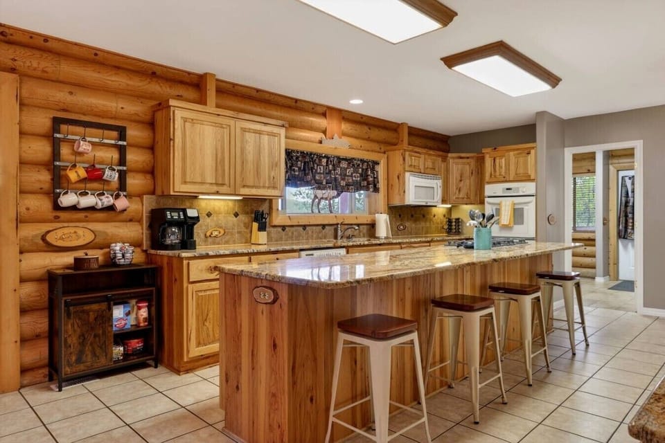 Large Kitchen Area + Bar Seating for 4
