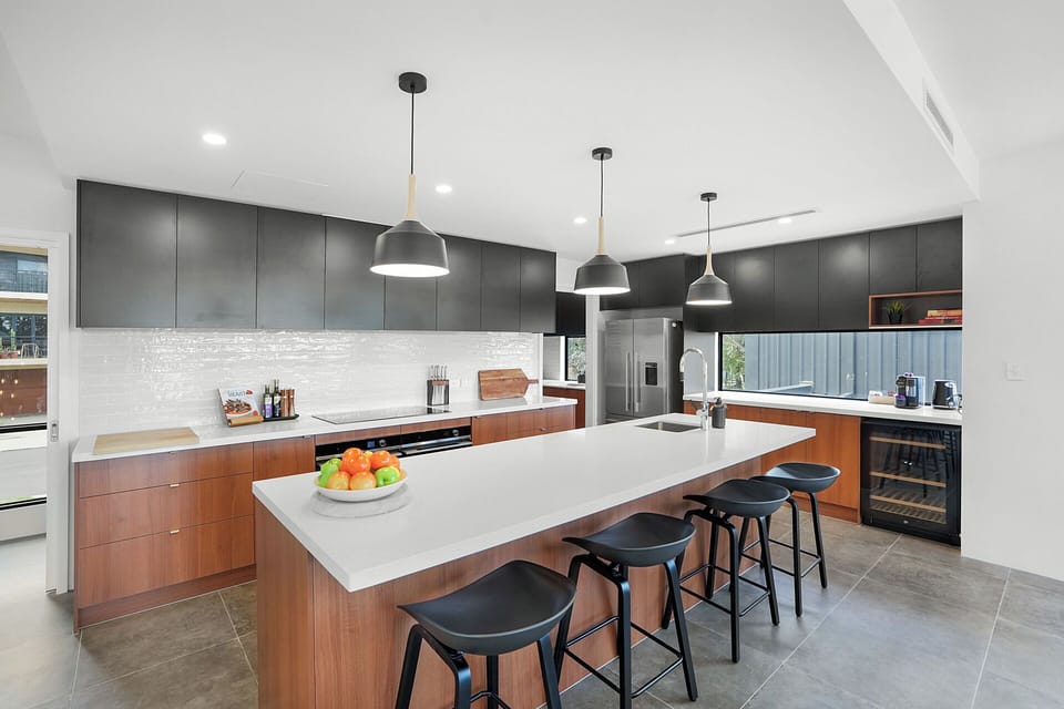 Spacious designer kitchen with island seating—perfect for gathering and entertaining.