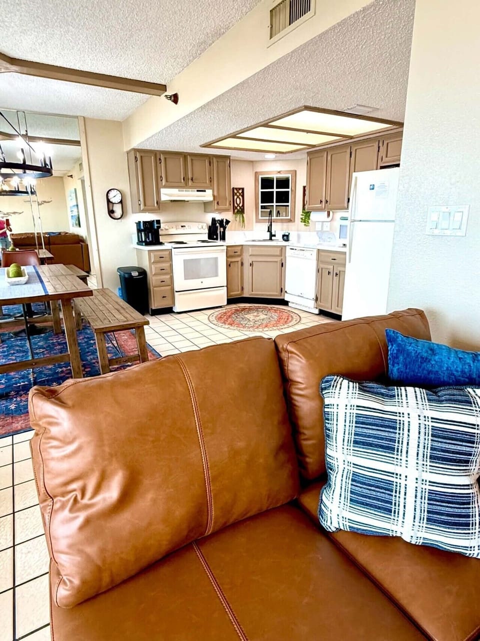 Open-concept living and kitchen with full appliances and dining area.