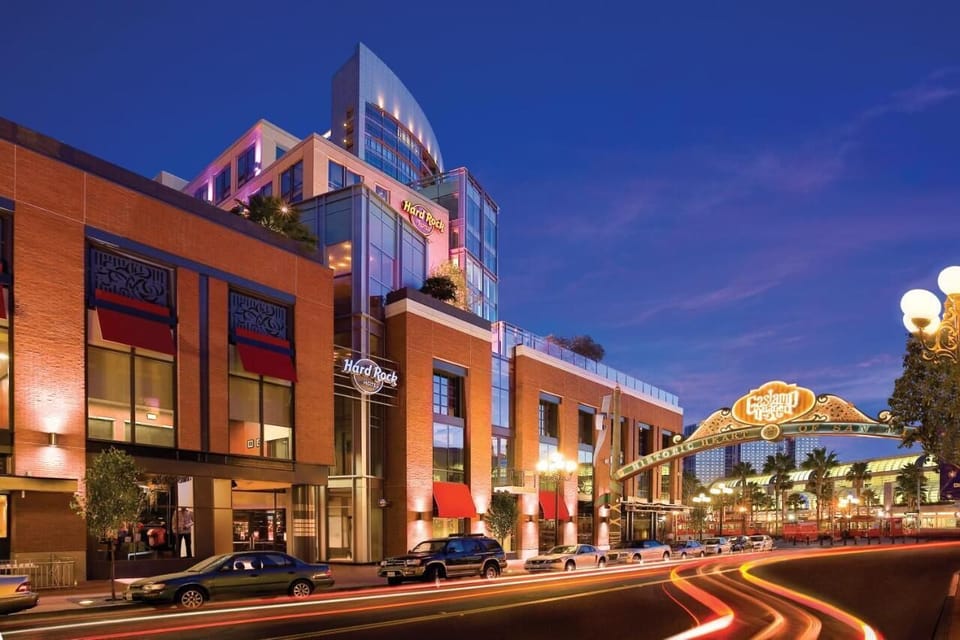 Arrive downtown to a striking exterior glowing at dusk.
