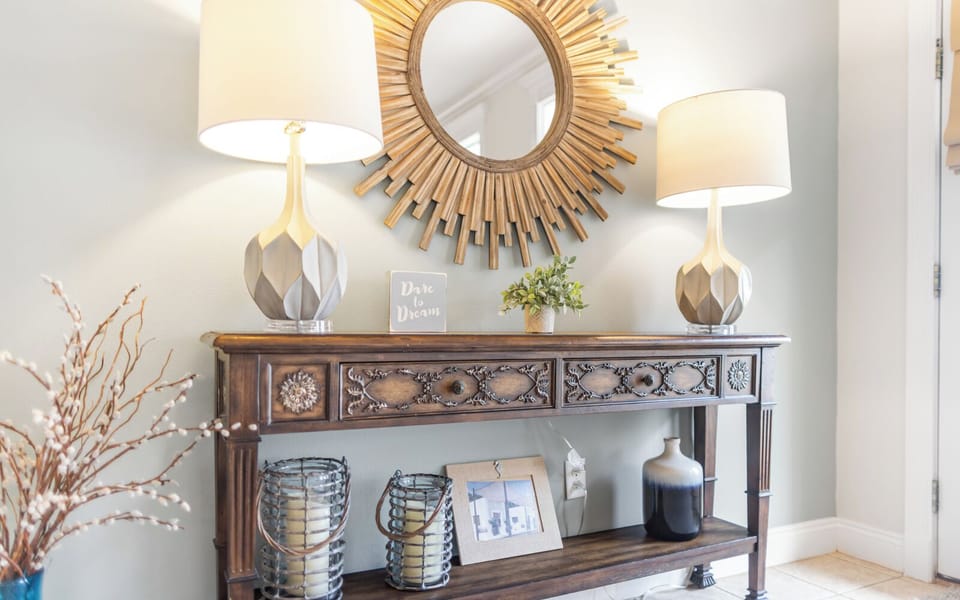 Bright beach-inspired living room with cozy seating, a TV, and coastal decor throughout.