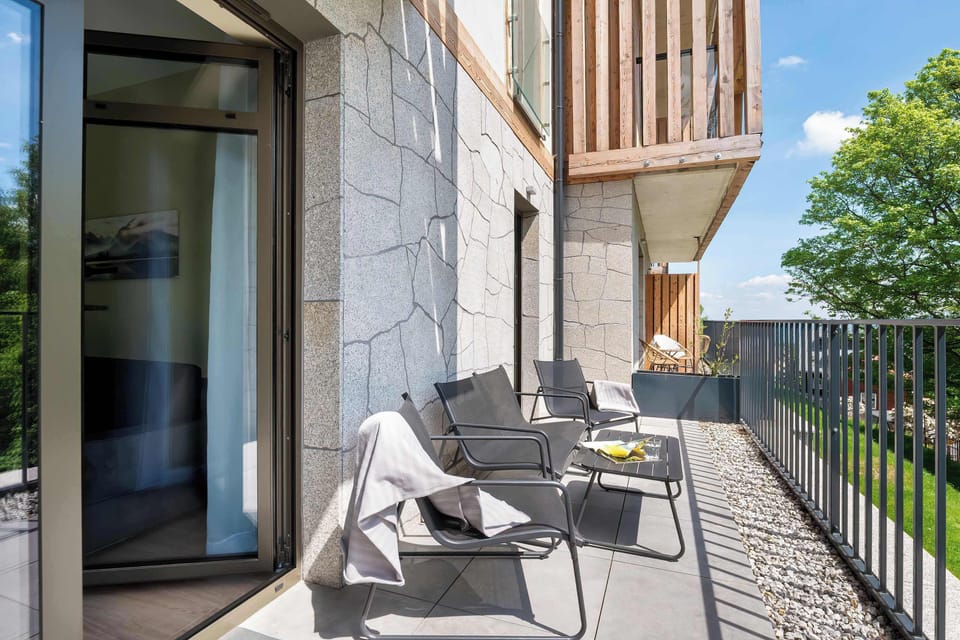 The balcony provides a serene environment for relaxation.