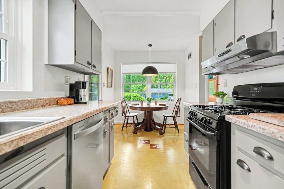 Convenient doorway connects the kitchen to the dining room for simple serving and shared meals.