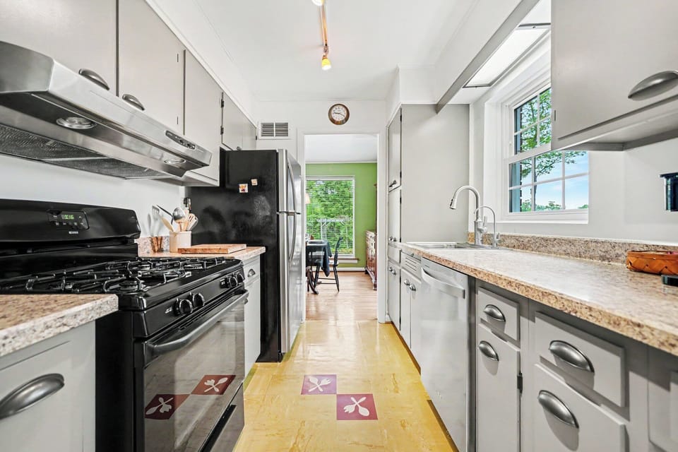 Bright, fully equipped kitchen with a cozy breakfast table. The perfect spot for morning coffee, quick meals, or keeping the cook company.