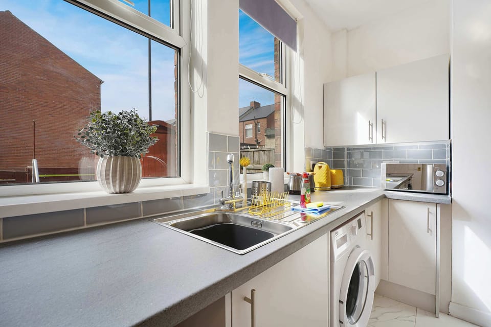 Cook comfortably in this well-equipped kitchen with generous counter space, modern appliances, and practical storage throughout. The functional layout and everyday essentials make meal preparation simple for both short and extended stays.