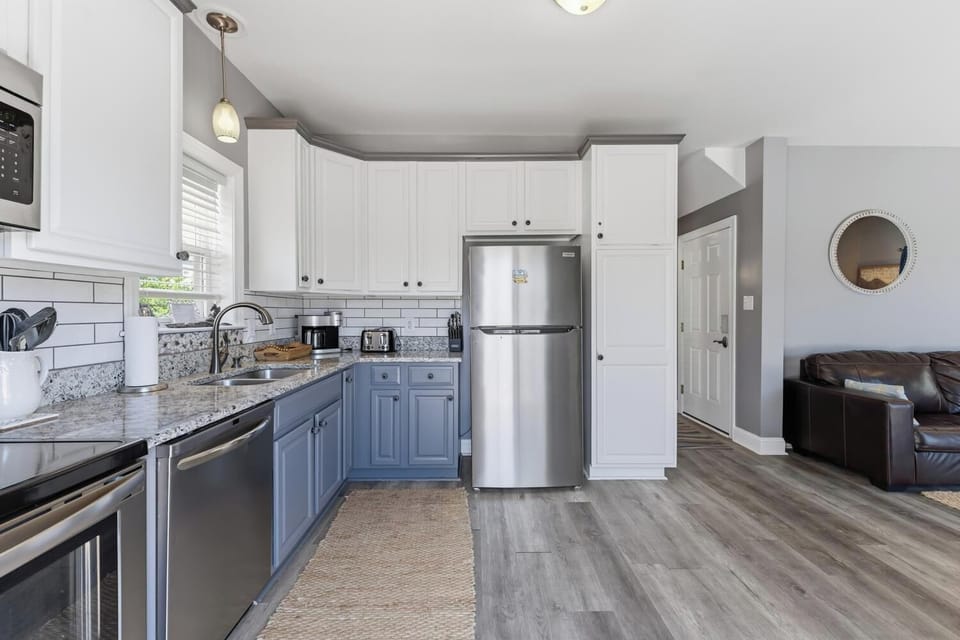 Step into a bright, fully equipped kitchen with granite countertops, stainless steel appliances, and everything you need to cook up a delicious meal during your stay.