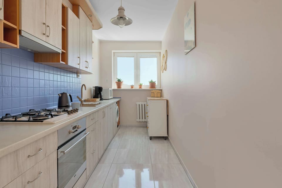 The kitchenette is designed to be practical and use space efficiently.