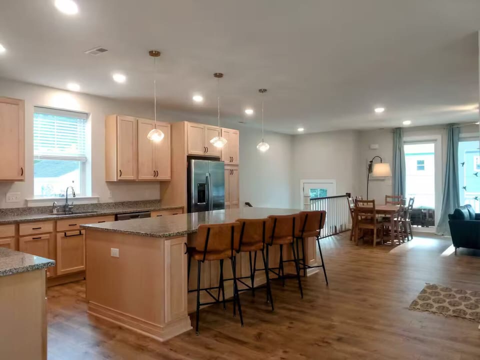 Kitchen, looking onto front entry and smaller dining table.