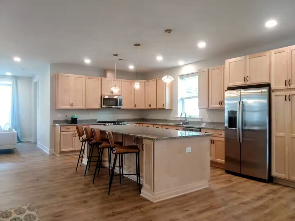 Well-stocked kitchen with labeled cabinets and drawers.