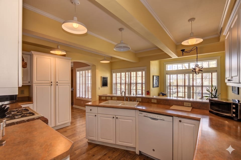 Enjoy your morning coffee or evening meals with a view in the bright and airy dining room, where large windows offer scenic vistas of the surrounding neighborhood