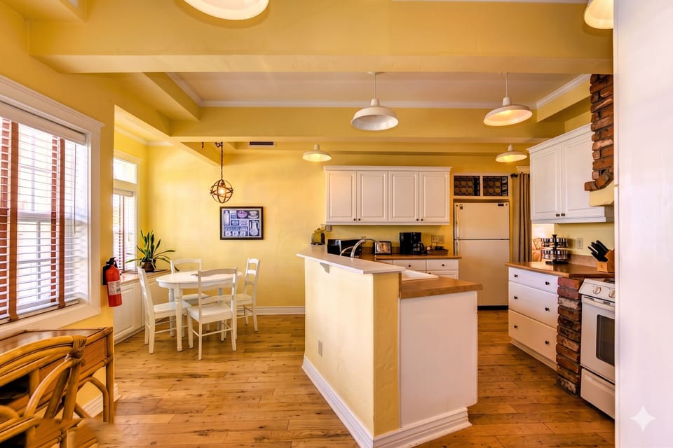 Whip up a meal in the fully-equipped modern kitchen, featuring modern appliances and a stylish breakfast bar.