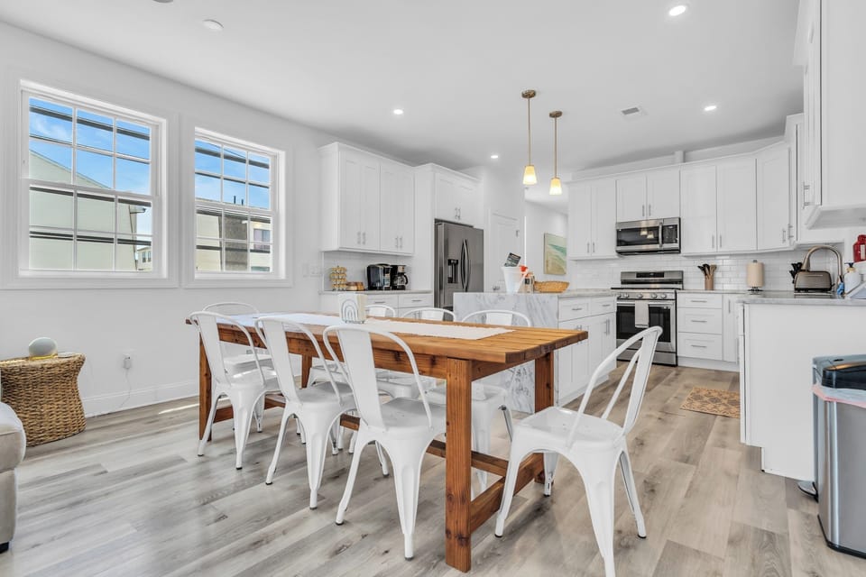 Bright modern kitchen with large dining table and sunny open layout