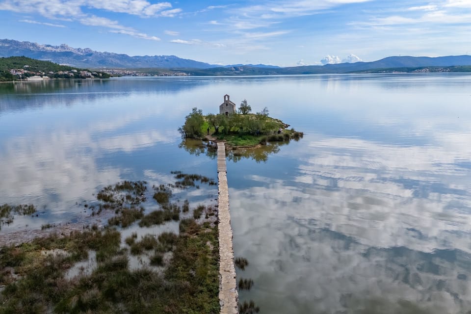 The small church of the Holy Spirit (Crkva Svetog Duha) on an island in Karinsko More, near the village of Posedarje