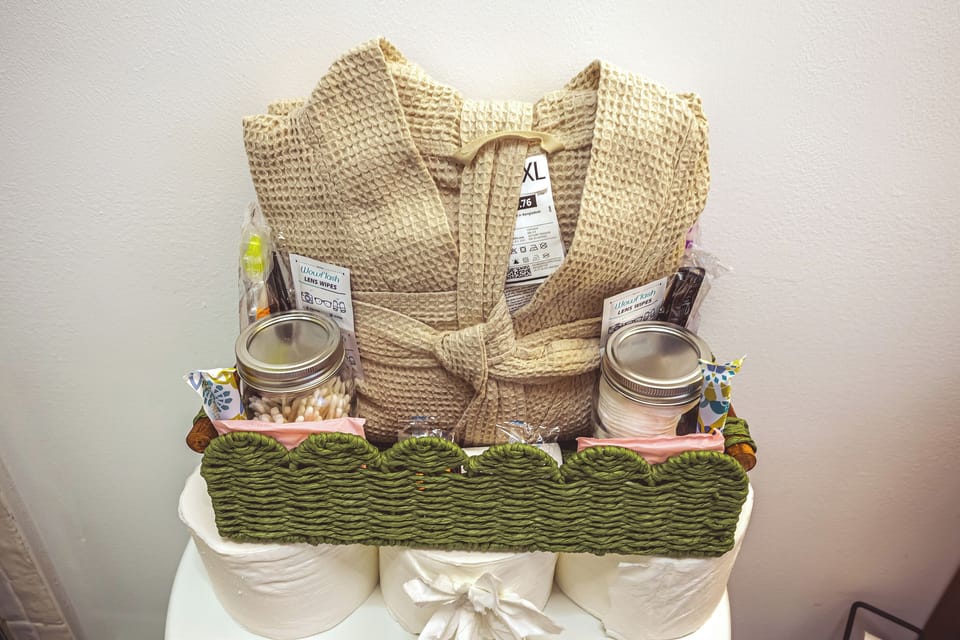 Welcome amenities at Inkwood Reserve — plush waffle robes and artisan toiletries to help you settle in at this Catskills cabin in Livingston Manor, NY
