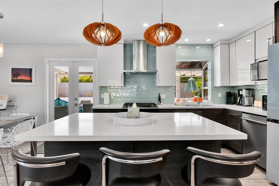 Updated chef's kitchen with island seating and premium appliances