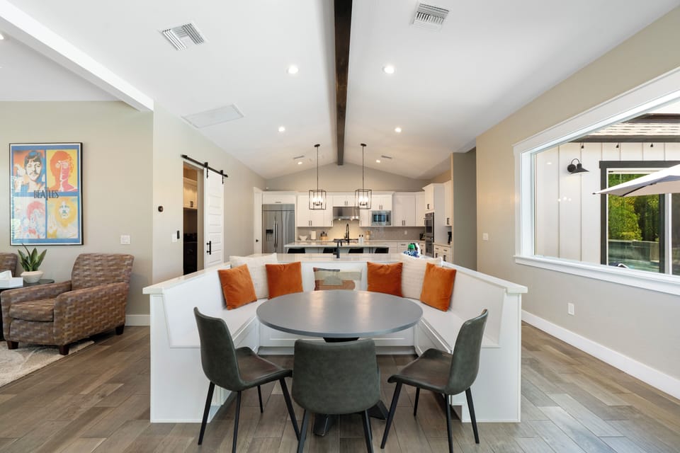 Open-concept dining and kitchen area designed for gathering and meals
