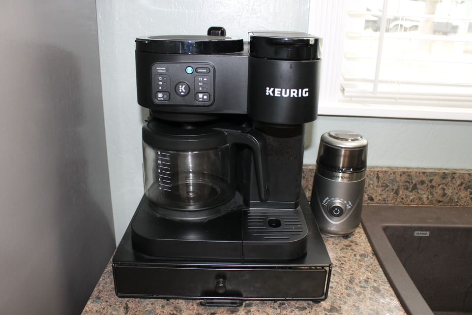 Brew a pot of coffee or just enjoy a K-Cup. Coffee bean grinder for convenience 