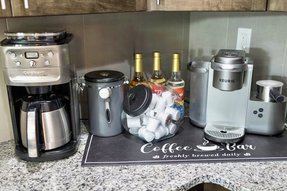 Coffee bar with two types of coffee makers and syrups 