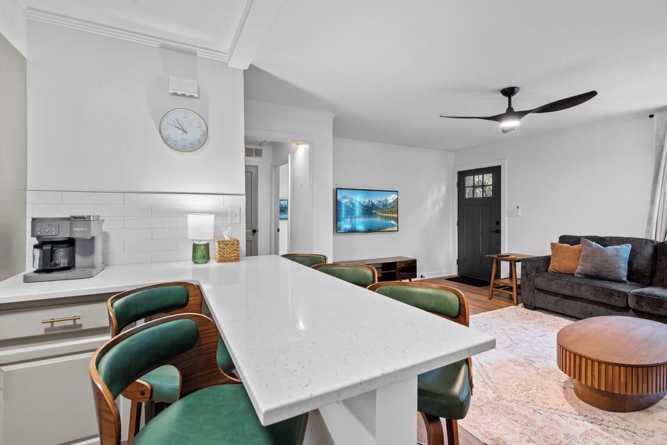 Stylish breakfast bar, coffee station, and cozy seating