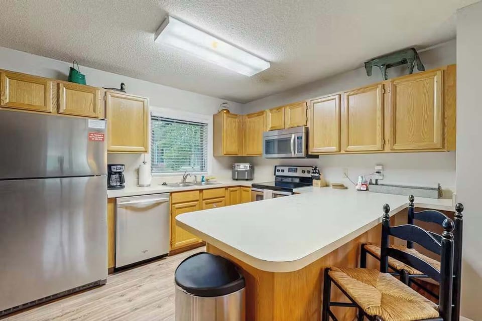 Kitchen: Drip coffee maker, air fryer, Crockpot, blender, toaster, tableware
