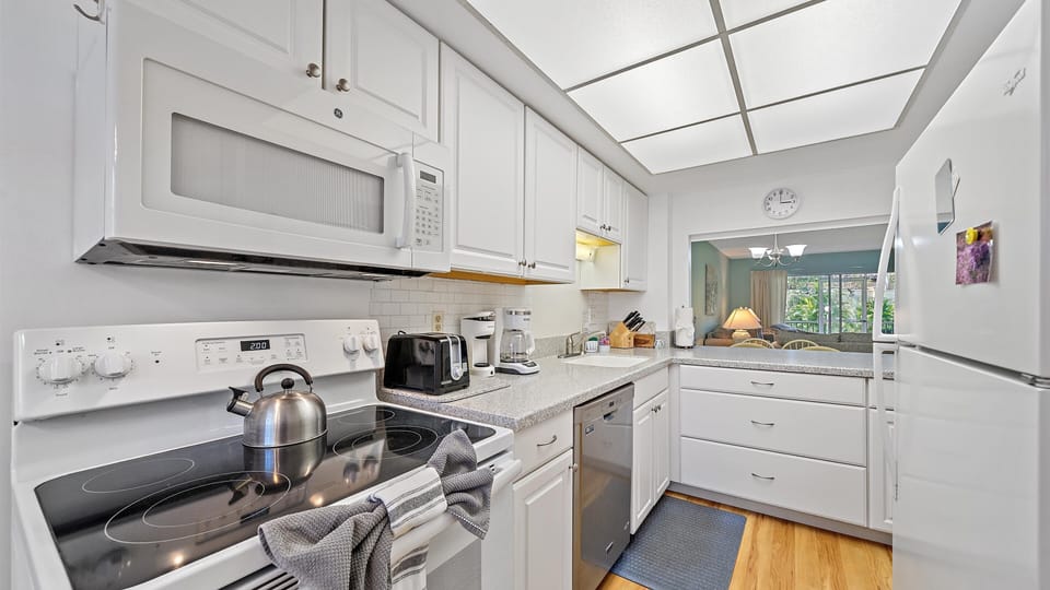 Your fully equipped kitchen features modern appliances, granite countertops, and bright skylights—perfect for preparing meals and gathering with loved ones in comfort.