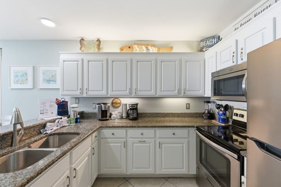 Fully Stocked Kitchen with Stainless Steel Appliances