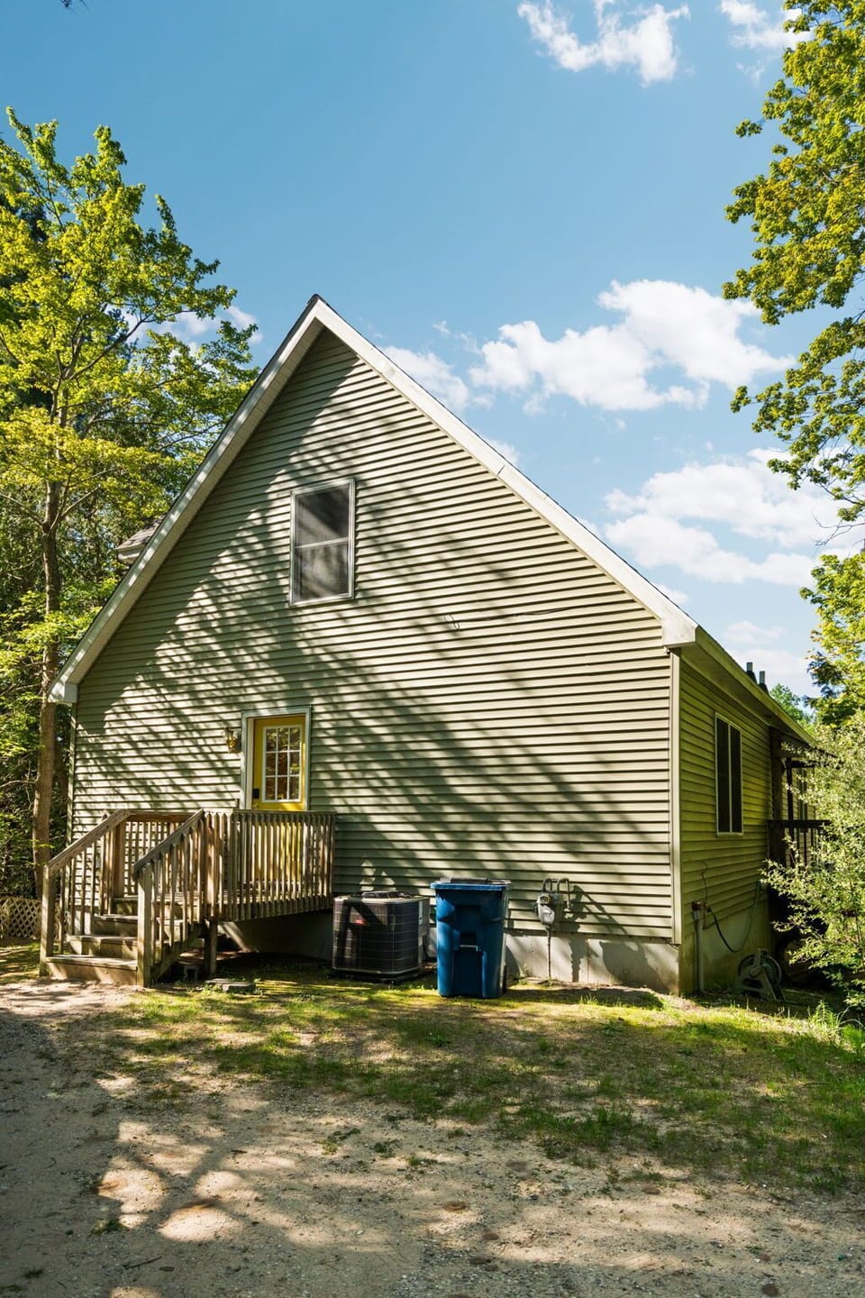 Cozy wooded cabin exterior with private, peaceful surroundings.
