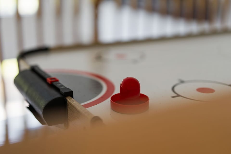 Competitive spirits will love the fast-paced air hockey table.