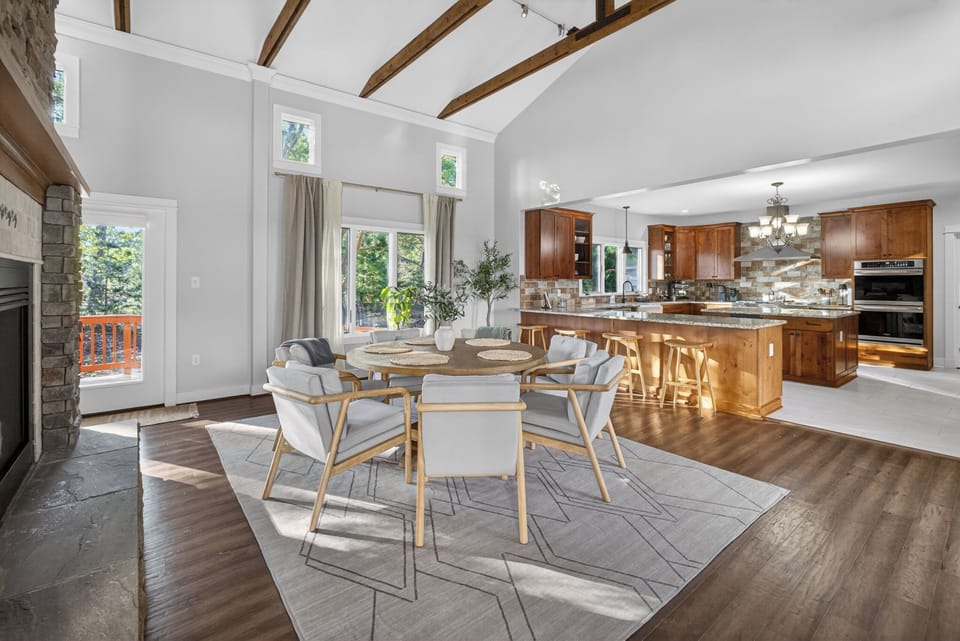 Open-concept living space with natural light and vaulted ceilings