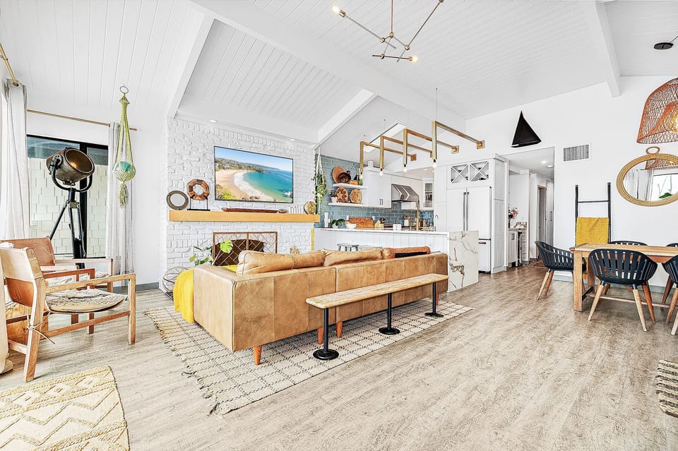 Bright open-concept living space with modern coastal style
                