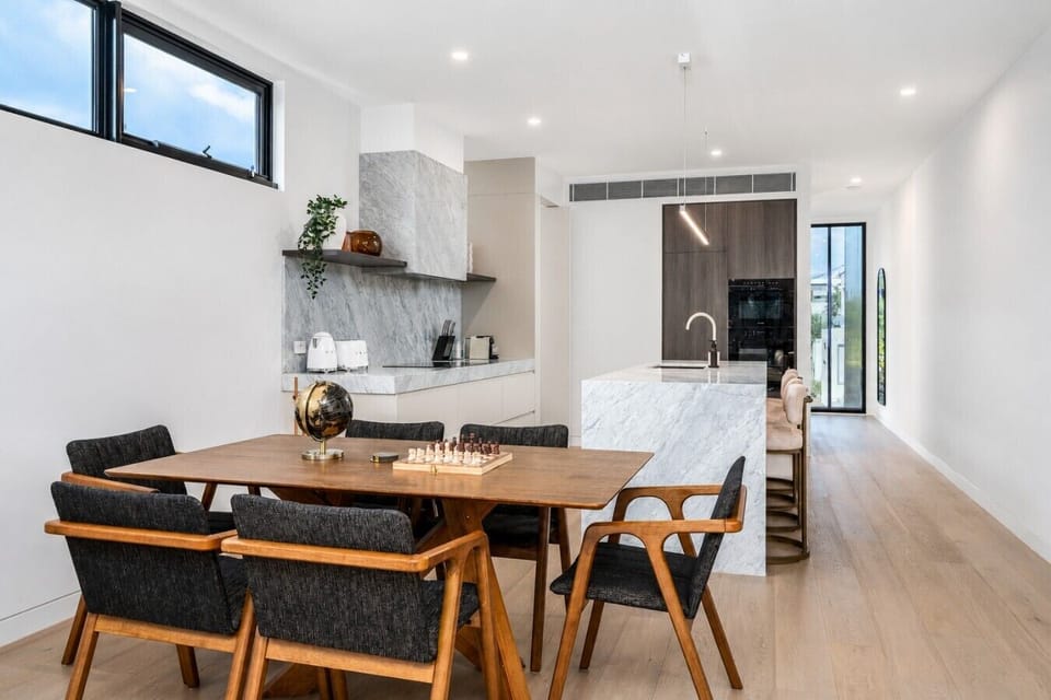 A beautifully styled, sunlit area perfect for home-cooked meals or takeaway nights.