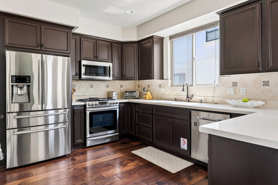 Generous counter space, modern fixtures, and deep drawers provide exceptional kitchen storage and functionality.