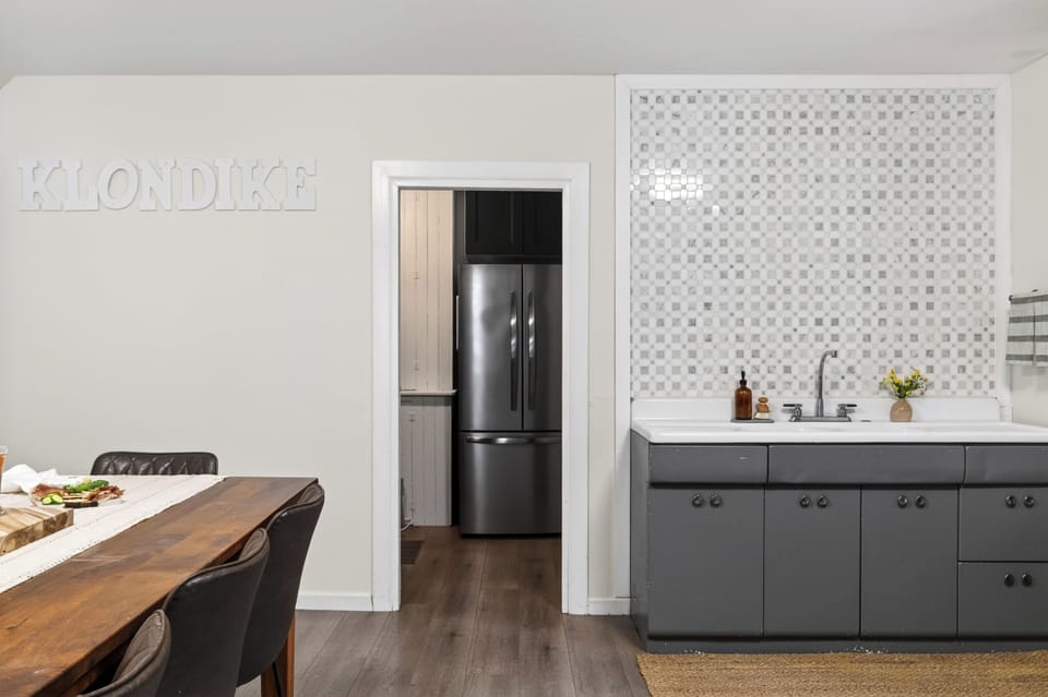 Dining area with a bonus wet bar and easy kitchen access for effortless group meals.