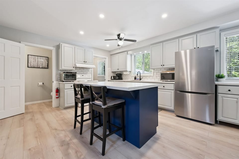 Fully equipped modern kitchen featuring a large island and everything needed for family meals and entertaining.