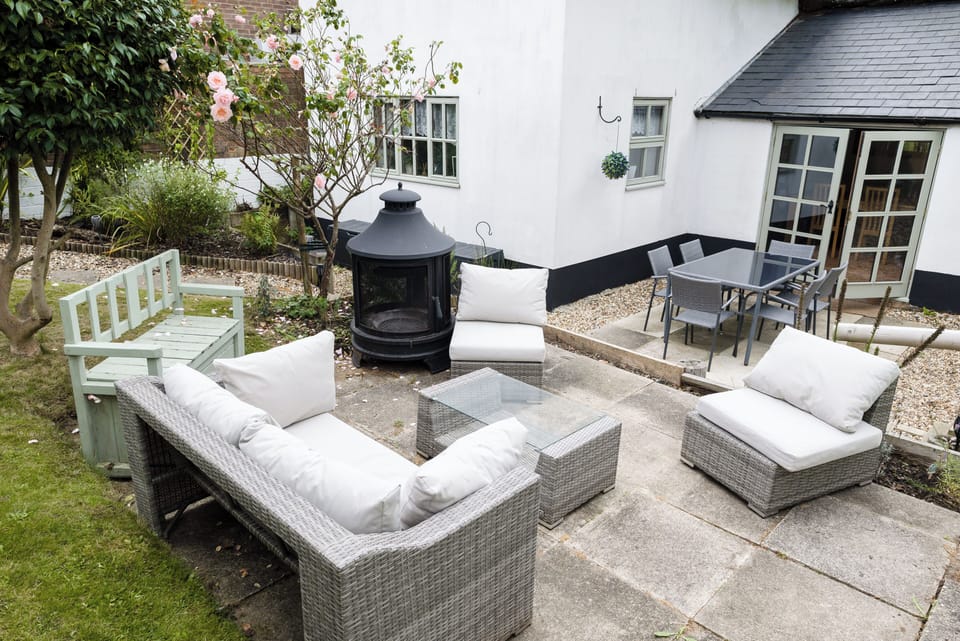 The fully enclosed garden is a peaceful private space. Laid to lawn