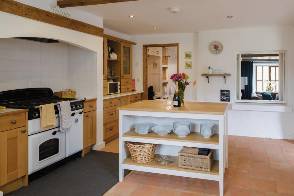 A thoughtfully equipped kitchen, complete with ample crockery and everything you