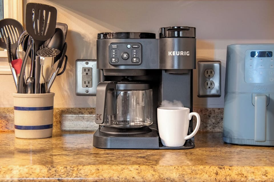 Your mornings start easy here—fresh coffee brewed just the way you like it, with all the tools you need for cooking and relaxing in this well-equipped kitchen.